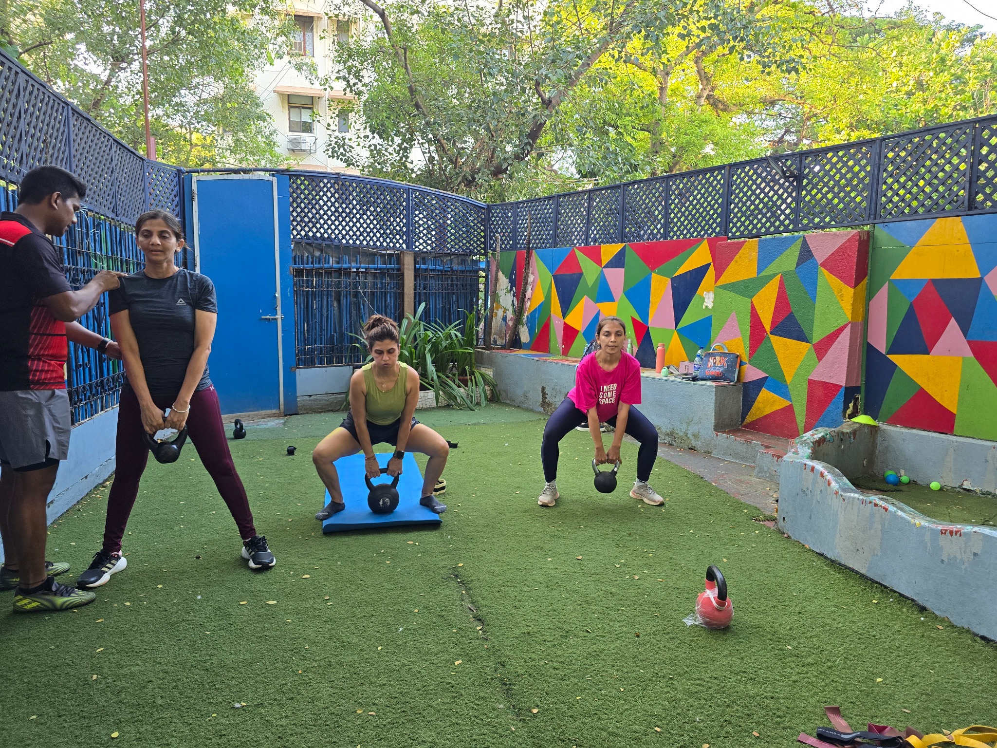Adults taking part in a group functional training session